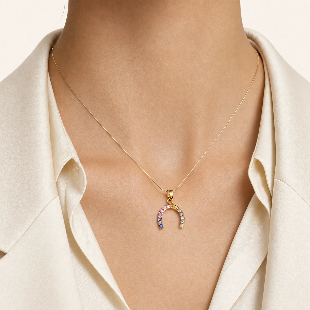 Rainbow sapphire horseshoe pendant